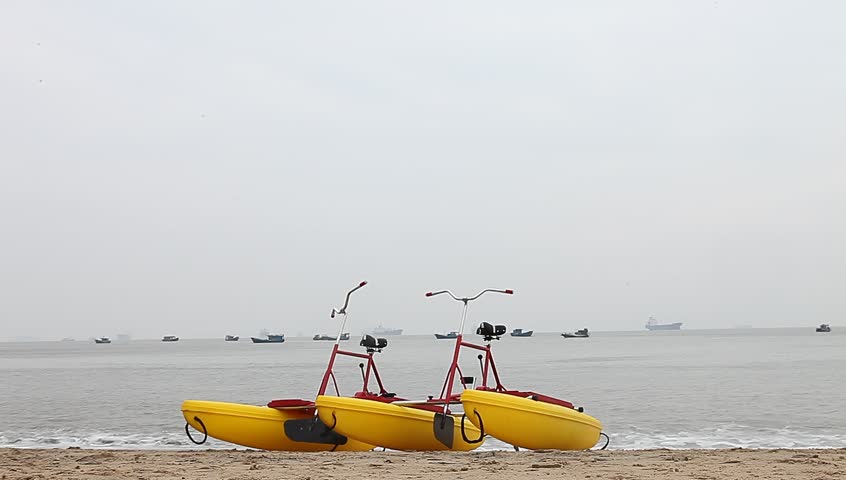 yellow  boats beached in the sand