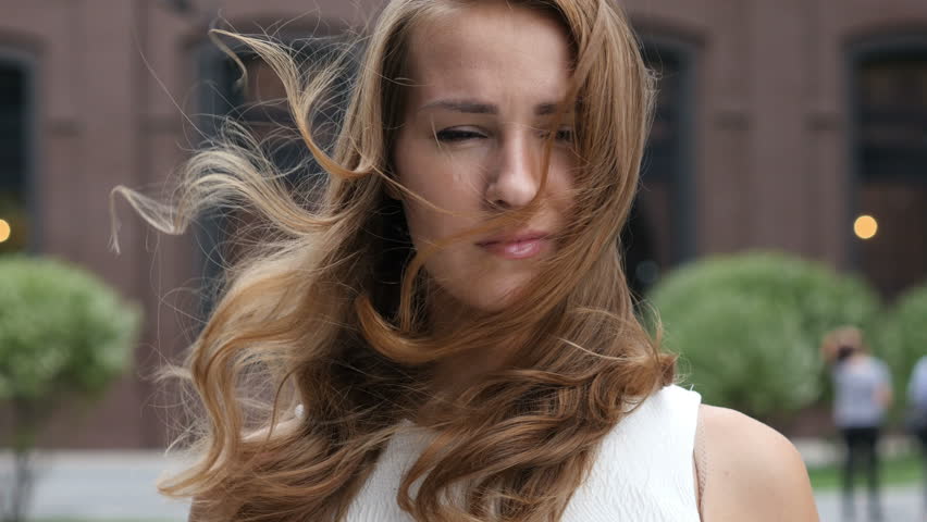 Flying Hairs in Wind of Beautiful young Girl, Outdoor