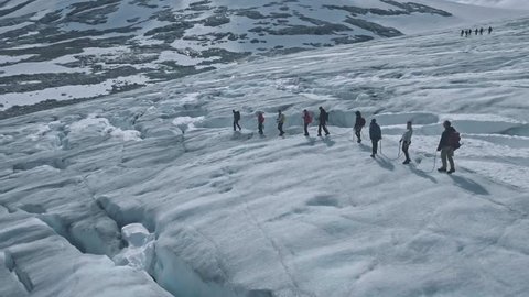 Jostedalsbreen, Norway - July 25, 2016: Amazing aerial view on scenic Jostedalsbreen glacier with group of climbers on it, Norway
