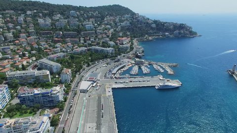 NICE, FRANCE - JUL 26, 2016: Marina with vessels in port of Nice near Mont Boron quarter and Parc Vigier on shore at summer sunny day. Aerial view