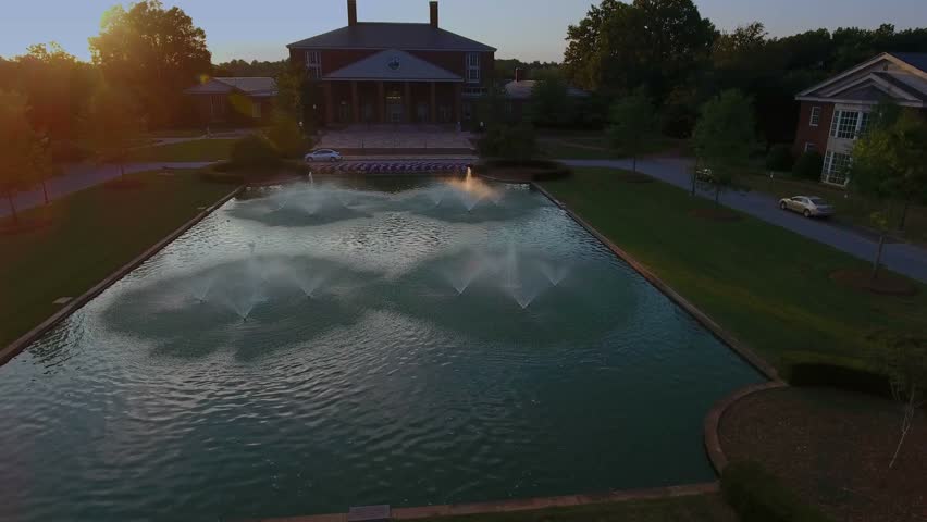Flying over Furman University at sunset in upstate South Carolina. Beautiful college campus in SC. 