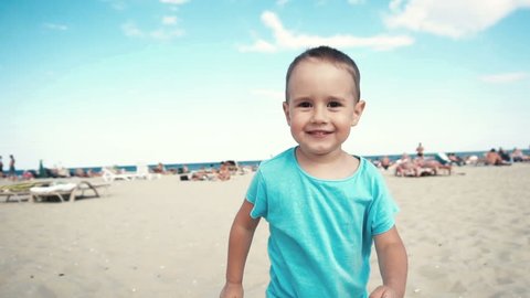 Little boy have fun on the beach