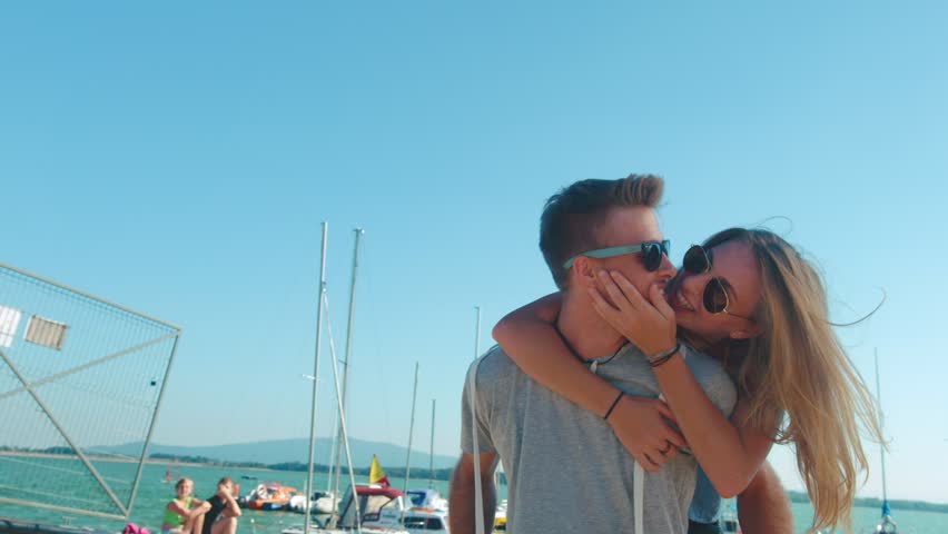 Attractive young couple having fun on the beach