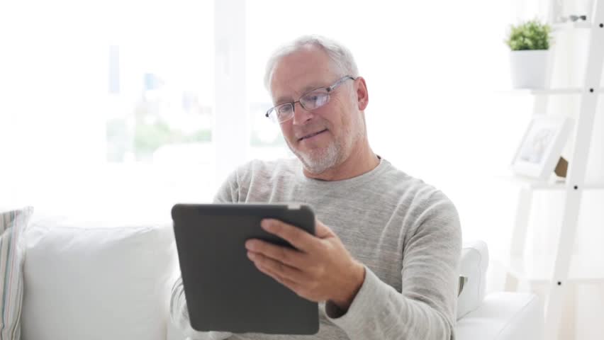 Technology, people and lifestyle, distance learning concept - senior man with tablet pc computer at home | Shutterstock HD Video #19253740