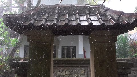 Raindrops Flowing Down a Tiled Roof. Slow Motion