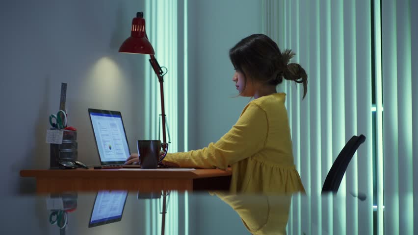 Young beautiful hispanic woman spilling coffee on documents while working with laptop pc at home, girl studying late at night, female college student doing education homework for school Royalty-Free Stock Footage #19263361