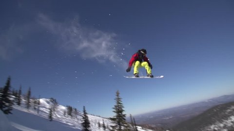 Snowboarder Slides In Mountain In Winter Day