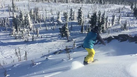 Snowboarder Slides In Mountain In Winter Day