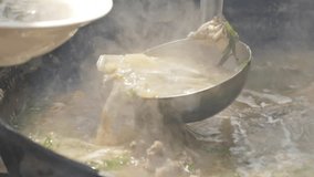 from the pot closeup of soup pours slow motion video