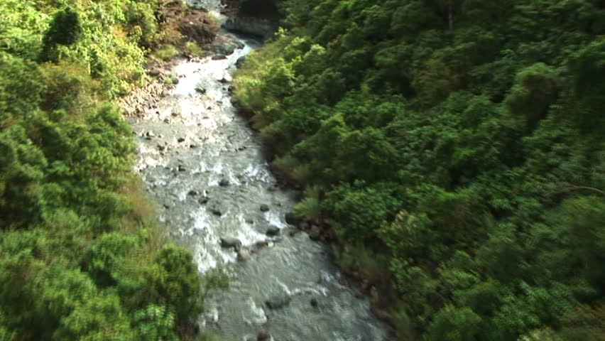 HD: Flying over river and waterfall in the Philippines