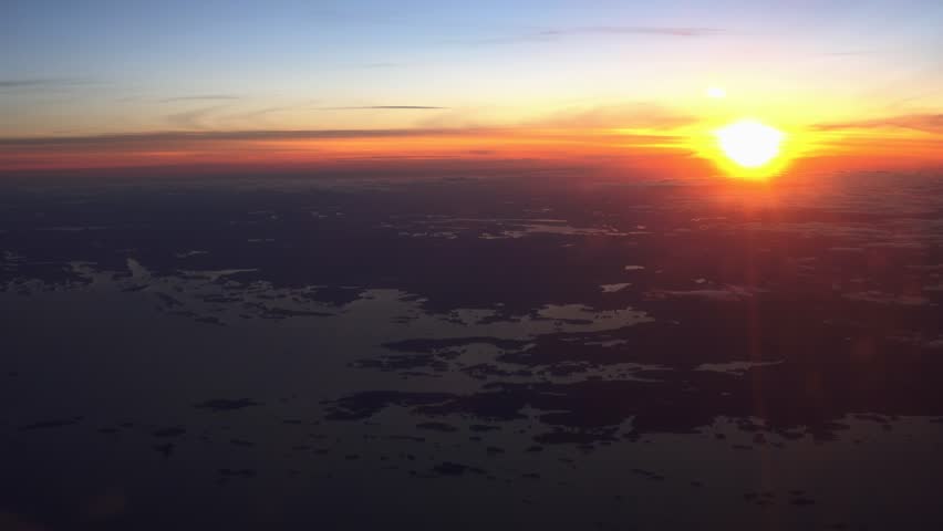 Sunset over the Baltic sea, outline of the coast of Finland, aerial view