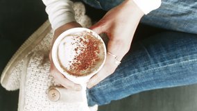 Cup of hot cocoa in woman's hands