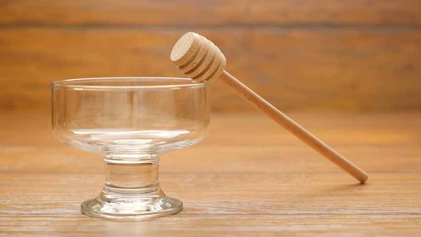 Honey is poured into a glass bowl (No 2)