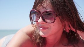 Self confident brunette female enjoying sun and ocean climate slow-mo 1920X1080 HD footage - Beautiful Caucasian woman relaxed and without problems slow motion 1080p FullHD video