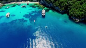 Tropical Ionian Greece Blue Lagoon island Aerial 4k travel video. Ocean sea forest coast seashore, water, yacht boat