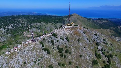 Mount Pantokrator Corfu top mountain summit Greece aerial 4k video panoramic. Peak communications technology station.