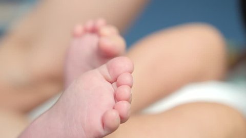 Close up of a cute little baby heels. Barefooted infant