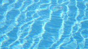 Blue water in swimming pool. Water motion