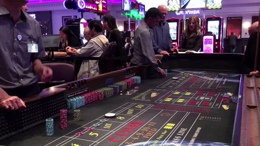 Coquitlam, BC, Canada - September 02, 2016 : People playing dice rolling across a craps table game inside Grand Villa Casino | Shutterstock HD Video #19310809
