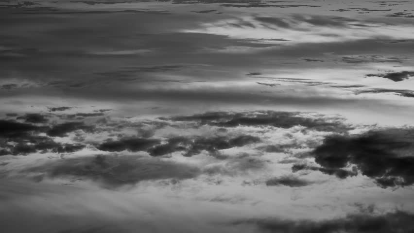 4K. Fragment of the sky with clouds at sunset. Time-lapse.
