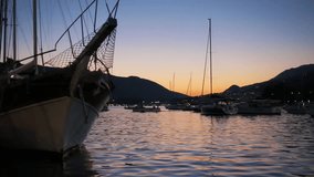 Boats in marina at sunset. Video clip.