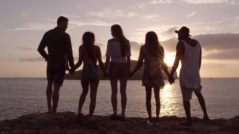 Friends Standing On Cliff Watching Sunset Shot On R3D