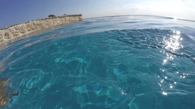 POV Travel Summer Vacation. Swimming in infinity pool, looking out over Mediterranean ocean and nature. HD VIDEO.
