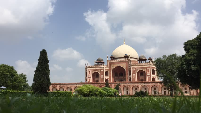 A time lapse footage taken from a lower angle showing people enjoying around the heritage place in New Delhi, India.