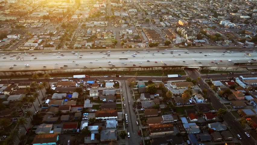 Freeway at sunset in Los Angeles, California. traffic passing by. Aerial footage. United States. Royalty-Free Stock Footage #19331350