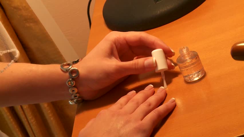 Woman applying nail polish