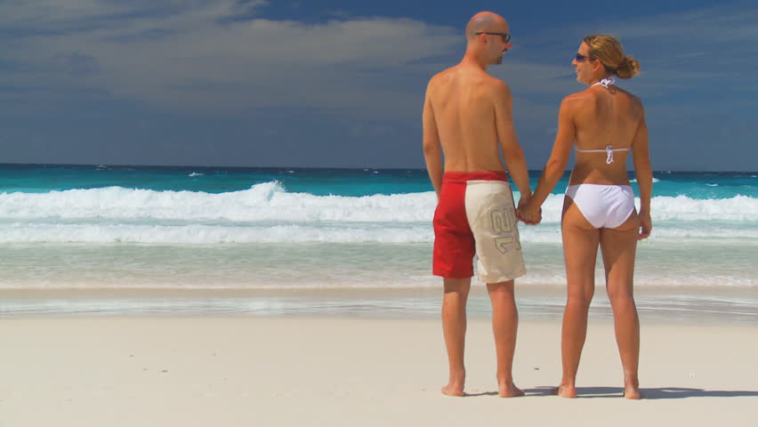 backview young couple standing on sandy Stock Footage Video (100% Royalty-f...