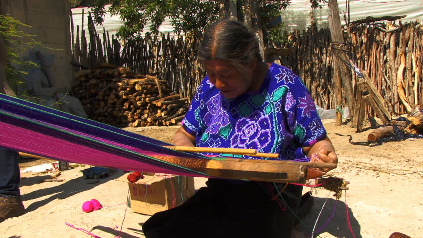 ZINACANTAN, CHIAPAS, MEXICO - CIRCA JUNE 2010: Mayan woman weaving traditional