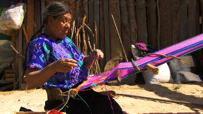 ZINACANTAN, CHIAPAS, MEXICO - CIRCA JUNE 2010: Mayan woman weaving traditional