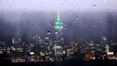Downpour over the Midtown Manhattan through window glass. View from Hoboken. NYC, USA.