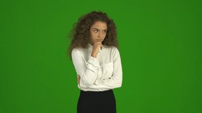 5 in 1 video! The curly businesswoman get an idea and stand on the green background. Real time capture