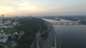 Panoramic view of Kiev Pechersk Lavra at sunset. Aerial view. General view of the city and the Dnipro river and beautiful sunset sky. 4k video
