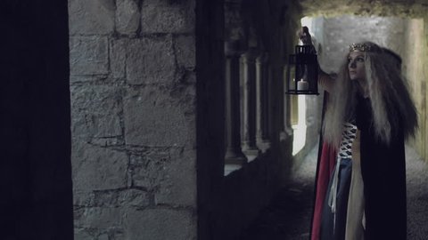 4k Medieval Shot of Game of Thrones Style Queen Walking in Castle with Candle