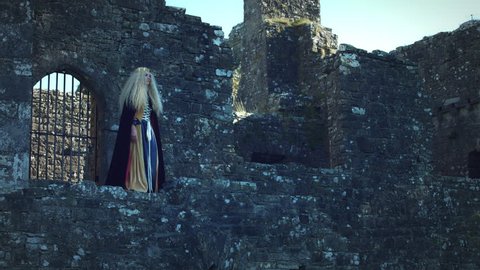 4k Medieval Shot Queen Standing in the Ruins of Castle : vidéo de stock