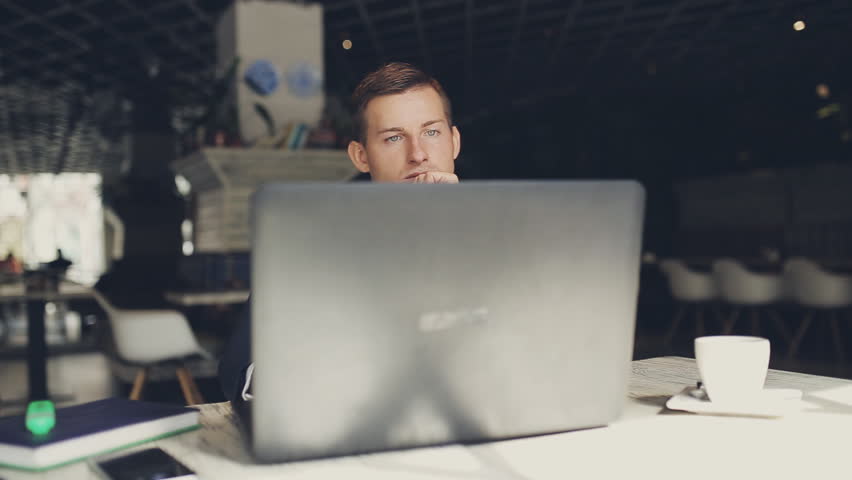 Man using laptop in cafe Royalty-Free Stock Footage #19398586