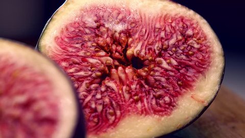 Cut ripe figs 4K close up pan shot
