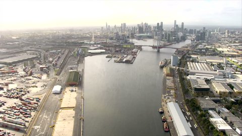 Melbourne aerial approach towards CBD over Bolte Bridge then along Yarra River