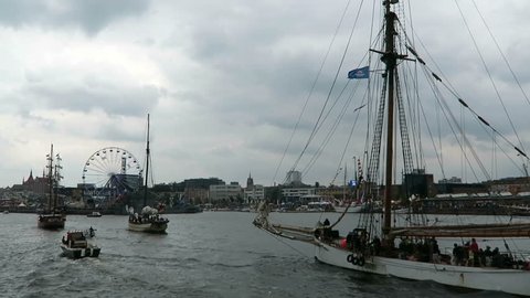 ROSTOCK, Mecklenburg-Vorpommern/ GERMANY AUGUST 13 2016: historical sailing boats and schooner sailing along the Rostock Harbor at Warnemuende during Hanse Sail weekend event. 