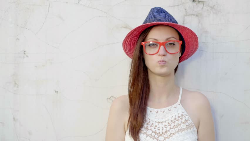 Hipster girl blows big bubble from bubble gum Royalty-Free Stock Footage #19430494
