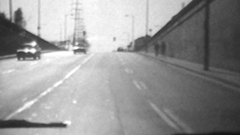 Los Angeles, California, USA - October 16, 1988:  Vintage super 8 time lapse driving shot on Fletcher Dr in Gendale, California. 