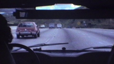 Thousand Oaks, California, USA - October 1, 1982::  Editorial vintage super 8 time lapse driving shot in the 101 Ventura Freeway through Calabasas near Los Angeles, California.