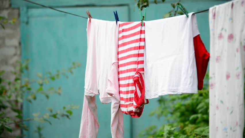 Linen is dried on rope in the garden