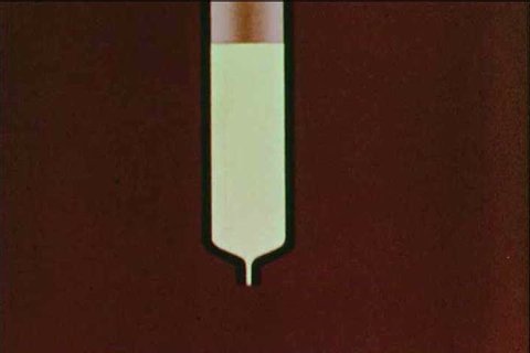 An animated sequence shows how an ion exchange column works in 1963. (1960s)