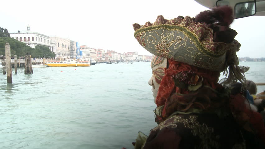 Boattrip on the Canale Grande with a masked person on the right
