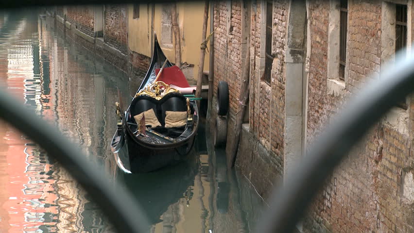 Empty gondola in Venice in a canal