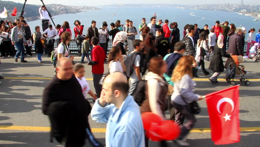 ISTANBUL - OCTOBER 17: Crowd of people walk from Asia to Europe through Bosporus